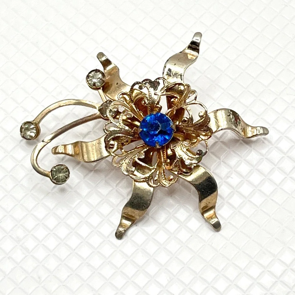 Vintage Gold Tone Flower Brooch w/ Blue and Clear Rhinestones